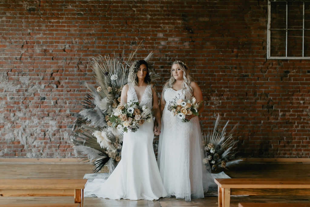Brides at industrial boho fall wedding in Tennessee
