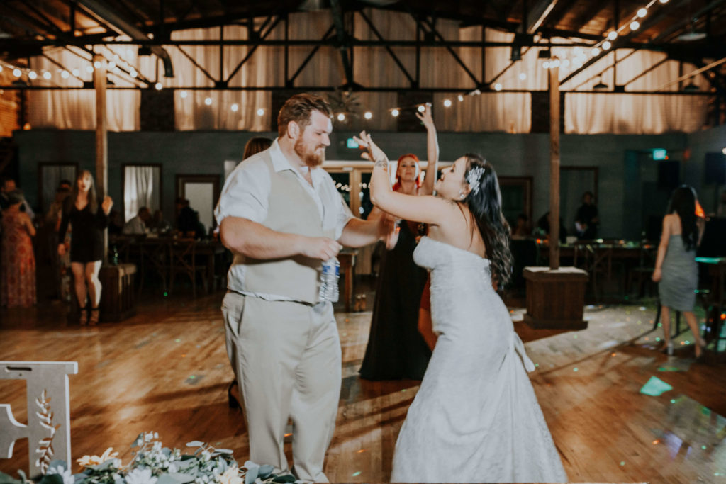 Bride and groom dancing at wedding reception in Tennessee