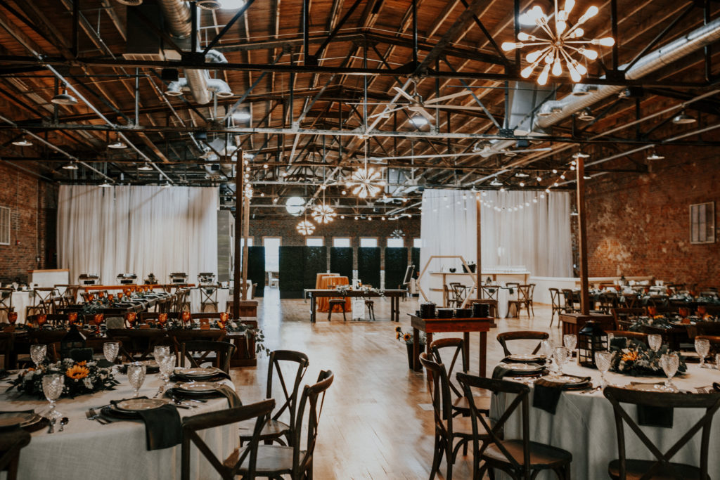 Rustic industrial wedding reception at White Star Station venue in Downtown Maryville, Tennessee