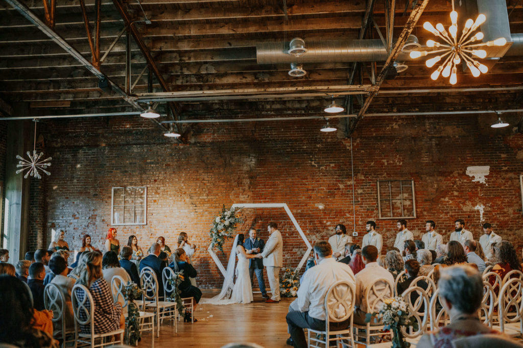 Rustic industrial wedding ceremony at White Star Station venue